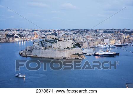 Stock Image - Fort St Angelo With The Marina, As Seen From Valletta At Dusk, Vittoriosa (Birgu), Malta. Fotosearch