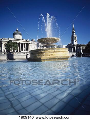 Fountain At Trafalgar Square With National Gallery And St Martins In The Fields Church, London. View Large Photo Image Stock Image - Fountain At Trafalgar Square With National Gallery And St Martins In The Fields Church, London.. Fotosearch