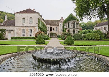 Stock Image - Fountain In The Garden Of The Cistercian Abbey Of Fontenay, Cote D'or, France. Fotosearch