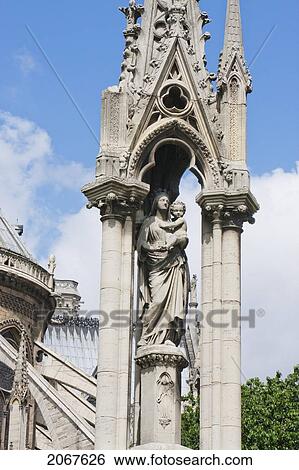 Stock Photograph - Fountain Of The Virgin Behind Notre Dame De Paris Cathedral, Paris, France. Fotosearch