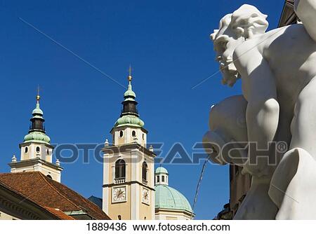 Stock Photograph - Fountain Statue With St. Niklas Cathedral In The Background.. Fotosearch