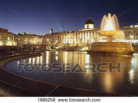Fountains In Trafalgar Square Looking Across To The National Portrait Gallery At Dusk View Large Photo Image Stock Photo - Fountains In Trafalgar Square Looking Across To The National Portrait Gallery At Dusk. Fotosearch