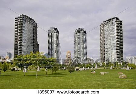Four Highrise Buildings With A Green Park In The Foreground; Vancouver, British Columbia, Canada View Large Photo Image Stock Photo - Four Highrise Buildings With A Green Park In The Foreground; Vancouver, British Columbia, Canada. Fotosearch