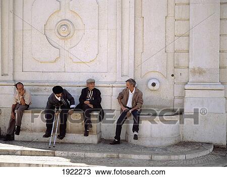 Four Men Sitting By Building View Large Photo Image Stock Image - Four Men Sitting By Building. Fotosearch