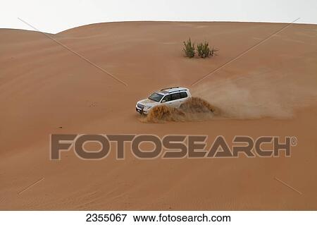 Four wheel driving in the desert; Liwa Oasis, Abu Dhabi, United Arab Emirates View Large Photo Image Stock Photo - Four wheel driving in the desert; Liwa Oasis, Abu Dhabi, United Arab Emirates. Fotosearch