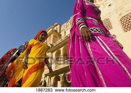 Four Women In Colorful Saris Walking Past Old Building View Large Photo Image Stock Image - Four Women In Colorful Saris Walking Past Old Building. Fotosearch