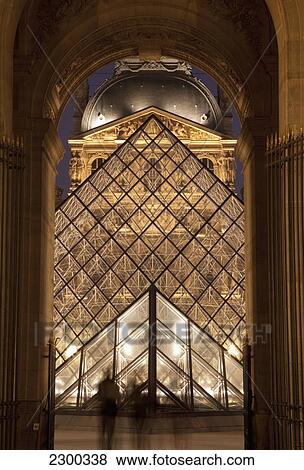 Stock Photo - France, Abstract view of Louvre and glass pyramid; Paris. Fotosearch