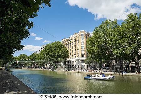 Stock Photography - France, Everyday scene by Canal Saint Martin; Paris. Fotosearch
