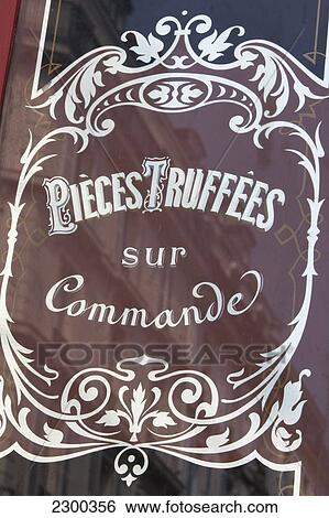 Stock Photograph - France, Exterior detail of food shop; Paris. Fotosearch