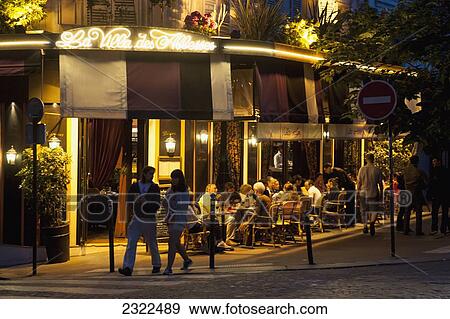 France, Montmartre; Paris, People enjoying summer night at sidewalk cafe View Large Photo Image Stock Photo - France, Montmartre; Paris, People enjoying summer night at sidewalk cafe. Fotosearch