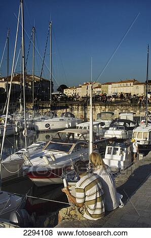 Stock Photo - France, Poitou-Charentes, Ile de Re, Sailing boats in harbor; St Martin de Re. Fotosearch