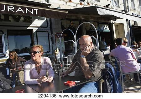 Stock Photograph - France, Poitou-Charentes, Pavement cafe; La Rochelle. Fotosearch