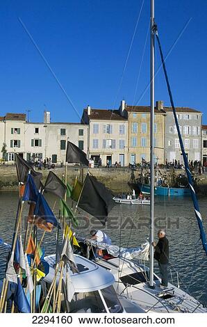 Stock Image - France, Poitou-Charentes, Sailing boats in old harbour; La Rochelle. Fotosearch