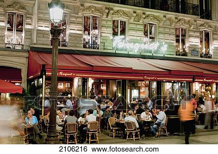 Stock Photograph - France, Sidewalk cafe at night; Paris. Fotosearch