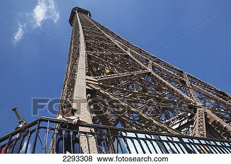 Stock Photo - France, Woman enjoying view from Eiffel Tower; Paris. Fotosearch