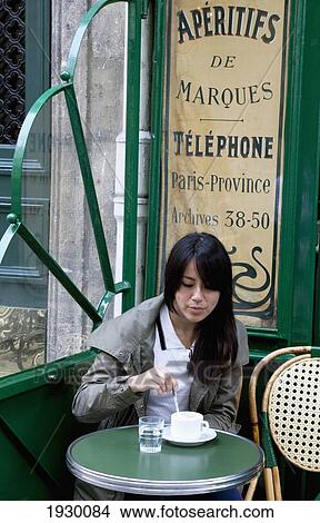 France, Woman sitting in sidewalk cafe; Paris View Large Photo Image Picture - France, Woman sitting in sidewalk cafe; Paris. Fotosearch
