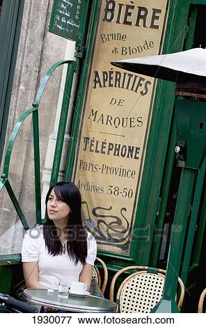France, Woman sitting in sidewalk cafe; Paris View Large Photo Image Stock Photo - France, Woman sitting in sidewalk cafe; Paris. Fotosearch