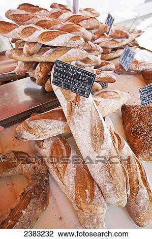 Stock Image - French bread for sale at a farmers market; Carcassonne, Aude department, France. Fotosearch
