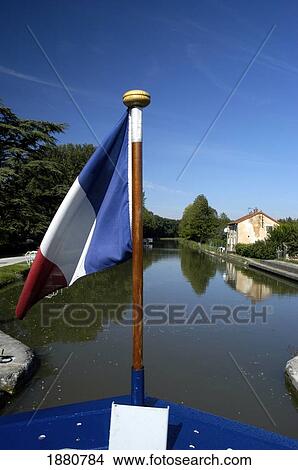 French Flag On Bow Of Barge On The Canal Du Centre View Large Photo Image Picture - French Flag On Bow Of Barge On The Canal Du Centre. Fotosearch