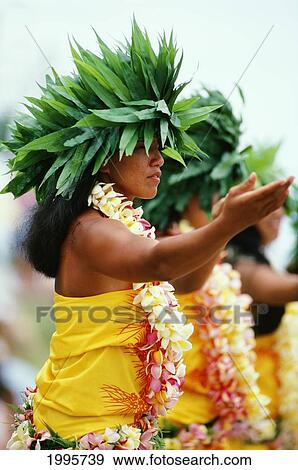 Stock Photo - French Polynesia, Bor Bora, Tahitian Dancers In Native Costume, Green Plant Headresses.. Fotosearch