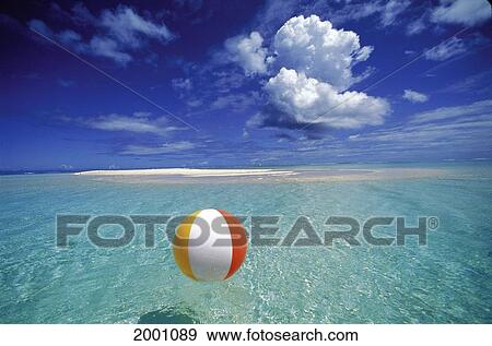 French Polynesia, Bora Bora, Calm Ocean With Beach Ball Foreground Patch Of Sand Background Blue Sky Clouds View Large Photo Image Stock Photo - French Polynesia, Bora Bora, Calm Ocean With Beach Ball Foreground Patch Of Sand Background Blue Sky Clouds. Fotosearch