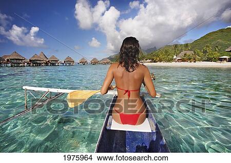 French Polynesia, Bora Bora, Female Kayaker Enjoying A Day On The Water. View Large Photo Image Picture - French Polynesia, Bora Bora, Female Kayaker Enjoying A Day On The Water.. Fotosearch
