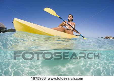 French Polynesia, Bora Bora, Female Kayaker Enjoying A Day On The Water. View Large Photo Image Stock Photograph - French Polynesia, Bora Bora, Female Kayaker Enjoying A Day On The Water.. Fotosearch