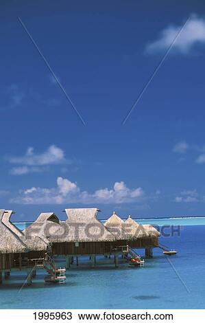 Stock Image - French Polynesia, Bora Bora, Water Bungalows On Beautiful Turquoise Water In. Fotosearch