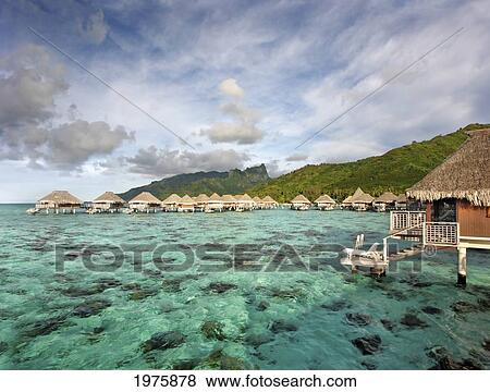 French Polynesia, Moorea Lagoon Resort, Bungalows Over Beautiful Turquoise Ocean. View Large Photo Image Stock Photo - French Polynesia, Moorea Lagoon Resort, Bungalows Over Beautiful Turquoise Ocean.. Fotosearch