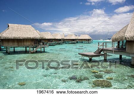 French Polynesia, Moorea, Luxury Resort Bungalows Over Ocean. View Large Photo Image Stock Photograph - French Polynesia, Moorea, Luxury Resort Bungalows Over Ocean.. Fotosearch