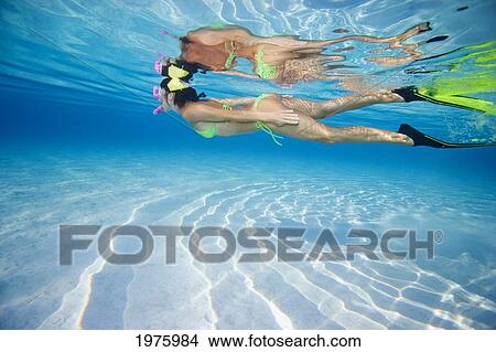 Picture - French Polynesia, Moorea, Woman Free Diving In Turquoise Ocean.. Fotosearch