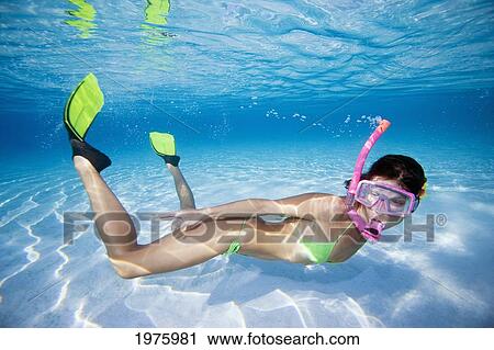 French Polynesia, Moorea, Woman Free Diving In Turquoise Ocean. View Large Photo Image Stock Image - French Polynesia, Moorea, Woman Free Diving In Turquoise Ocean.. Fotosearch