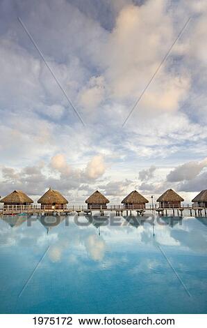 Stock Image - French Polynesia, Pearl Resort, Bungalows Over Beautiful Turquoise Ocean.. Fotosearch