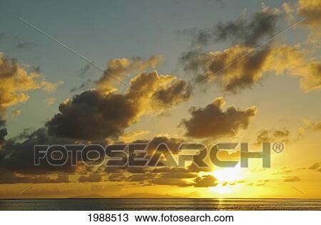 French Polynesia, Raiatea, Sun Shining Through Clouds Over The Ocean At Sunset View Large Photo Image Stock Image - French Polynesia, Raiatea, Sun Shining Through Clouds Over The Ocean At Sunset. Fotosearch