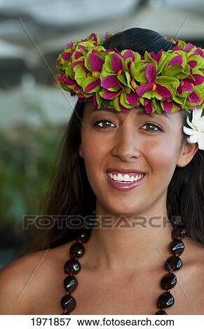 Stock Photo - French Polynesia, Tahiti, Bora Bora, A Local Woman Smiles In Her Floral Headpiece.. Fotosearch