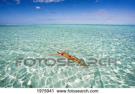 Stock Image - French Polynesia, Tahiti, Bora Bora, Woman Enjoy A Day In The Ocean.. Fotosearch