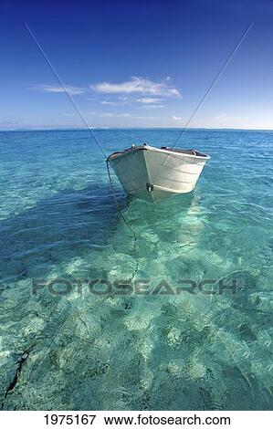 Stock Photo - French Polynesia, Tahiti, Bora Bora, White Boat Floating On Turquoise Water.. Fotosearch