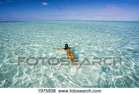 Stock Photo - French Polynesia, Tahiti, Bora Bora, Woman Enjoy A Day In The Ocean.. Fotosearch