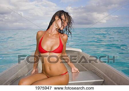 Stock Photo - French Polynesia, Tahiti, Bora Bora, Woman Sitting In Boat.. Fotosearch