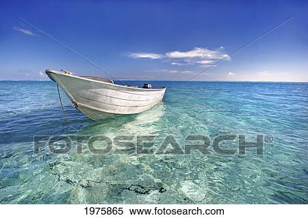 Stock Photography - French Polynesia, Tahiti, Bora Bora, White Boat Floating On Turquoise Water.. Fotosearch