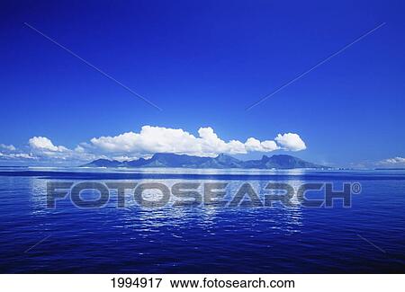 Stock Photo - French Polynesia, Tahiti, Cumulus Clouds Over A Calm Ocean.. Fotosearch
