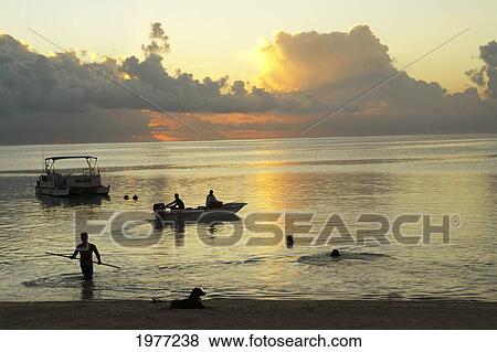 French Polynesia, Tahiti, Lagoon Sunset With Water Activities; Maupiti View Large Photo Image Stock Photo - French Polynesia, Tahiti, Lagoon Sunset With Water Activities; Maupiti. Fotosearch