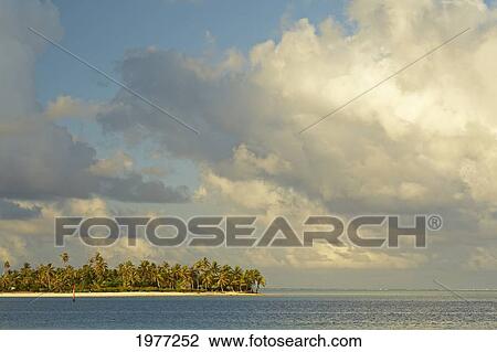 Stock Image - French Polynesia, Tahiti, Lagoon With Island and Sky; Maupiti. Fotosearch