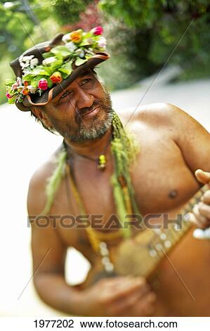 Stock Image - French Polynesia, Tahiti, Maupiti, Local Street Musician.. Fotosearch