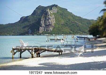 French Polynesia, Tahiti, Maupiti, Lagoon With Boats, Docks And Mountain. View Large Photo Image Stock Photo - French Polynesia, Tahiti, Maupiti, Lagoon With Boats, Docks And Mountain.. Fotosearch