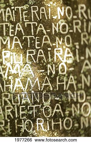 Stock Photograph - French Polynesia, Tahiti, Maupiti, Tahitian Writing At Ancient Sacred Site.. Fotosearch