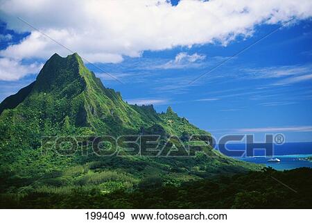 Stock Photo - French Polynesia, Tahiti, Moorea, Mount Rotui, Green Mountaintop, Ocean Below. Fotosearch