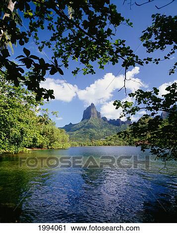 Stock Image - French Polynesia, Tahiti, Moorea, View Of Mount Rotui From Across Opunohu Bay. Fotosearch