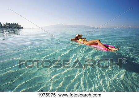 French Polynesia, Tahiti, Moorea, Woman Floating In Water. View Large Photo Image Stock Photography - French Polynesia, Tahiti, Moorea, Woman Floating In Water.. Fotosearch