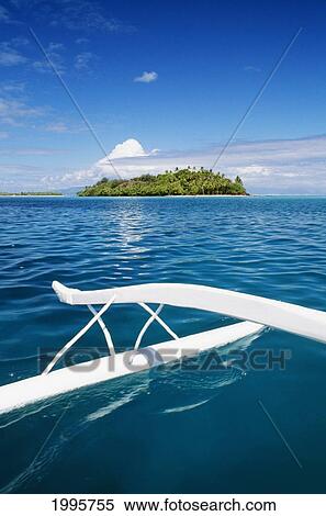 Stock Photography - French Polynesia, Tahiti, Outrigger In Coral Waters Of Bora Bora, Motu In Background. Fotosearch